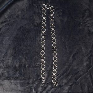 A silver chain belt.